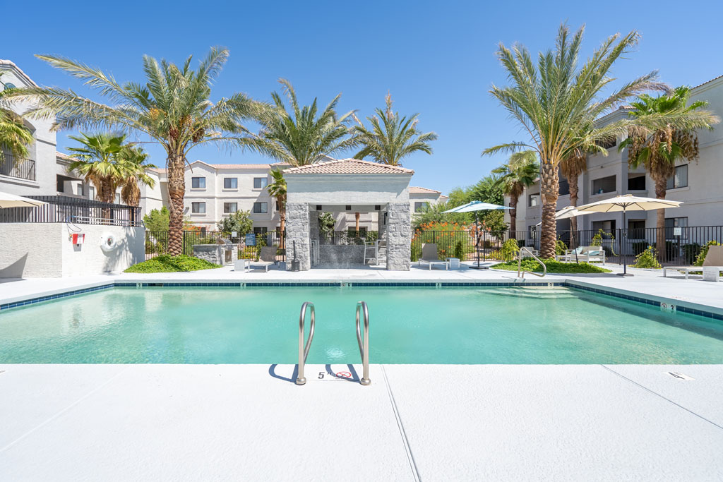 Pool with deck seating and covered grill pavilion